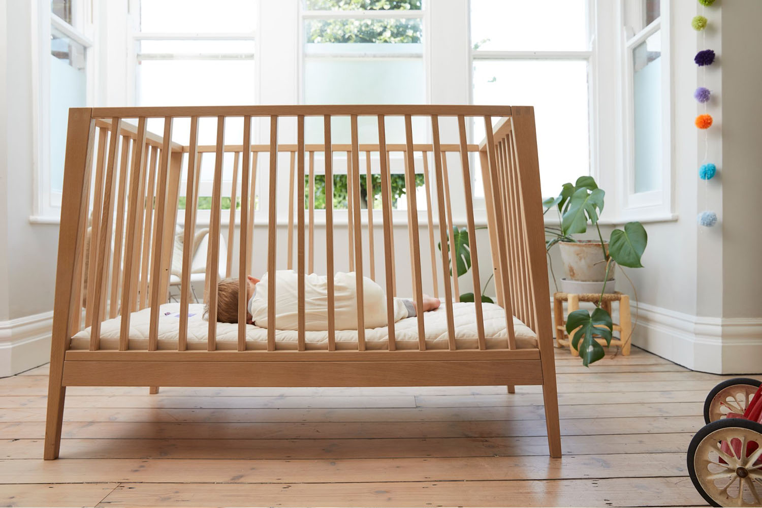 What is the difference between a cot and a cotbed?