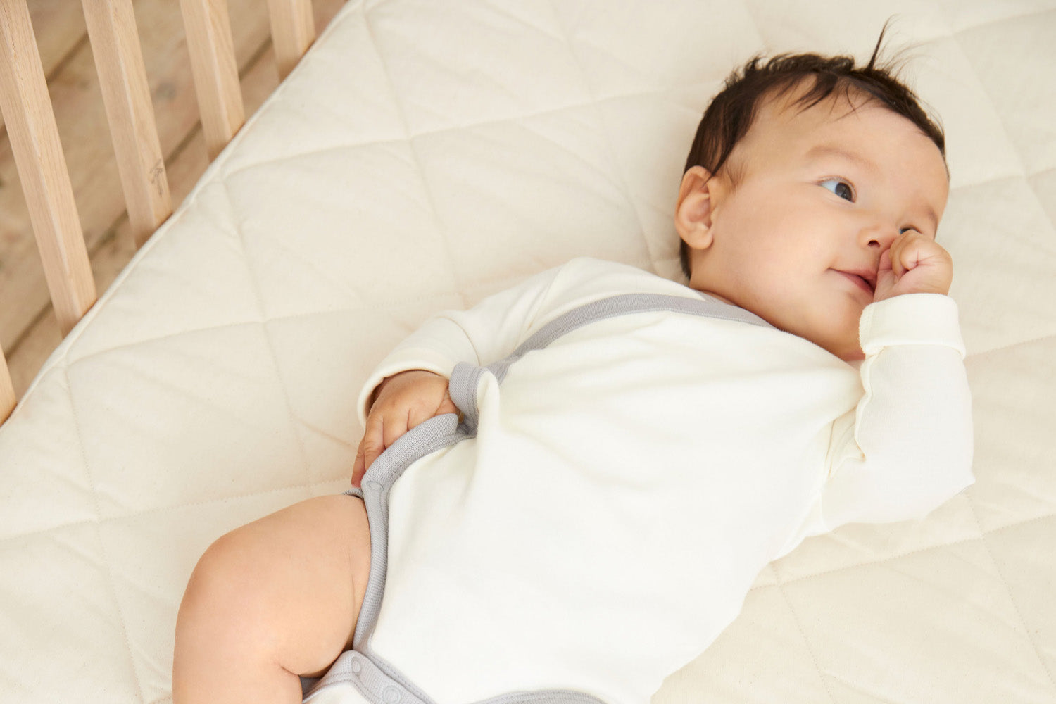 Why do babies need a firm mattress?